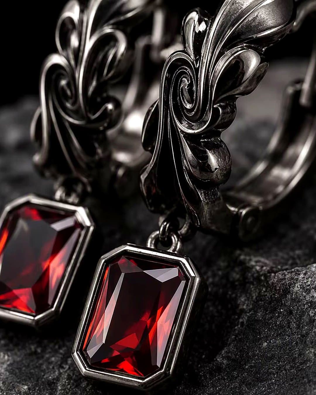 Square-cut red crystal earrings on ornate gunmetal hoops