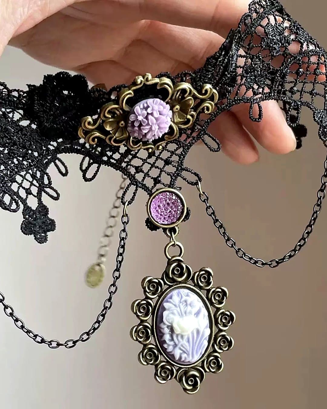 Black lace choker with a lilac cameo pendant on fine chains